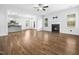 Open floor plan showcasing living room with fireplace and kitchen at 401 Club Center Dr, Youngsville, NC 27596