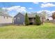 Backyard featuring a deck, trees, and lawn with a view of the house's exterior at 408 Teal Lake Dr, Holly Springs, NC 27540