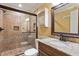 Updated bathroom featuring a tiled shower with glass door and granite vanity at 408 Teal Lake Dr, Holly Springs, NC 27540