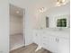Modern bathroom with double sinks, a walk-in closet, and sleek fixtures, providing ample space at 426 Adams Pointe Ct, Angier, NC 27501