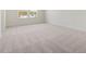 Bedroom with neutral carpet and a window overlooking the neighborhood at 426 Adams Pointe Ct, Angier, NC 27501