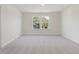 Carpeted room with natural light streaming through the double windows, creating an airy feel at 426 Adams Pointe Ct, Angier, NC 27501