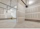Large unfinished garage with concrete floor and staircase to upper level perfect for future projects at 426 Adams Pointe Ct, Angier, NC 27501