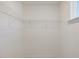 Walk-in closet with single row of white wire shelving installed at 426 Adams Pointe Ct, Angier, NC 27501