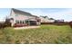 Expansive backyard featuring a patio, deck, and lush greenery, perfect for outdoor activities and relaxation at 43 Summerseat Way, Bunnlevel, NC 28323