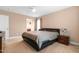 Neutral Primary bedroom with ceiling fan, plush carpeting, and ensuite bathroom at 43 Summerseat Way, Bunnlevel, NC 28323