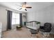 Bedroom with a crib, chair and ottoman and white dresser at 43 Summerseat Way, Bunnlevel, NC 28323