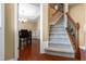 Foyer with hardwood floors, carpeted stairs and dining area with chandelier at 43 Summerseat Way, Bunnlevel, NC 28323