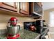 Close-up of kitchen featuring granite countertops, stainless steel appliances, and stylish cabinetry, great for cooking at 43 Summerseat Way, Bunnlevel, NC 28323