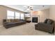 Spacious living room features a cozy fireplace, large windows, and comfortable seating, perfect for relaxation at 43 Summerseat Way, Bunnlevel, NC 28323