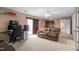 Spacious living room features a wet bar, comfortable seating, and a walk-out patio at 43 Summerseat Way, Bunnlevel, NC 28323
