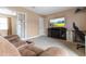 Cozy living room featuring comfortable seating, a fireplace, and a TV for entertainment at 43 Summerseat Way, Bunnlevel, NC 28323