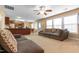 Open-concept living area with natural light, seamless flow to kitchen, and comfortable seating arrangement at 43 Summerseat Way, Bunnlevel, NC 28323