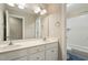 Bright bathroom with double vanity and a shower/tub combo at 4313 Branchwood Dr, Durham, NC 27705