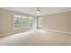 Large bedroom with big windows and light carpet at 4313 Branchwood Dr, Durham, NC 27705