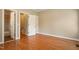 Empty bedroom with hardwood flooring and a view of an ensuite bath at 4313 Branchwood Dr, Durham, NC 27705