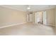 Spacious bedroom with light carpet and open doorway to an ensuite bathroom at 4313 Branchwood Dr, Durham, NC 27705