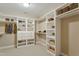 Walk-in closet with built-in shelving, cabinets, and ample storage space at 4313 Branchwood Dr, Durham, NC 27705