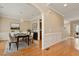 Formal dining area features hardwood floors, elegant wainscoting, and a view into the entry hall at 4313 Branchwood Dr, Durham, NC 27705