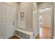 Inviting entryway featuring a built-in bench with storage and coat hooks at 4313 Branchwood Dr, Durham, NC 27705