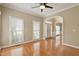 Elegant foyer showcasing hardwood floors, arched doorway, and lots of natural light at 4313 Branchwood Dr, Durham, NC 27705