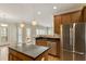 Modern kitchen with stainless steel appliances, granite countertops, and an island with pendant lighting at 4313 Branchwood Dr, Durham, NC 27705