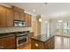 Bright kitchen with stainless steel appliances, granite countertops, and a central island at 4313 Branchwood Dr, Durham, NC 27705