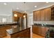 Spacious kitchen with granite countertops, stainless steel appliances, and wood cabinets at 4313 Branchwood Dr, Durham, NC 27705