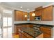 Modern kitchen featuring granite countertops, stainless steel appliances, and center island at 4313 Branchwood Dr, Durham, NC 27705