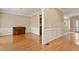 Spacious living room featuring hardwood floors, crown molding, and a piano at 4313 Branchwood Dr, Durham, NC 27705