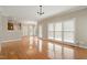 Bright living room featuring hardwood floors, ample natural light, and neutral tones at 4313 Branchwood Dr, Durham, NC 27705