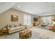 Cozy living room featuring neutral sofas, a coffee table, and a ceiling fan at 4313 Branchwood Dr, Durham, NC 27705
