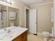 Bathroom with a single sink, mirror and a combined shower and bath at 4502 Mill Creek Rd, Cedar Grove, NC 27231