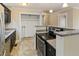Kitchen featuring sleek appliances, granite countertops and ample storage space at 4502 Mill Creek Rd, Cedar Grove, NC 27231