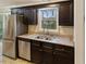 Kitchen featuring stainless steel appliances, dual sink, and granite counter tops at 4502 Mill Creek Rd, Cedar Grove, NC 27231