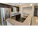 Modern kitchen with stainless steel appliances and dark cabinetry at 4502 Mill Creek Rd, Cedar Grove, NC 27231