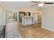Hardwood living room showcasing stainless steel kitchen appliances at 4502 Mill Creek Rd, Cedar Grove, NC 27231