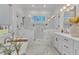 This elegant bathroom has a soaking tub and separate glass enclosed shower at 472 Stonecrest Way, Pittsboro, NC 27312