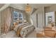 Comfortable bedroom with a cozy sitting area, soft lighting, and tranquil decor at 472 Stonecrest Way, Pittsboro, NC 27312
