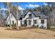 Attractive two-story home featuring a well-maintained front lawn and inviting curb appeal at 472 Stonecrest Way, Pittsboro, NC 27312