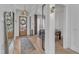 Welcoming foyer with a clear view to the dining room, wood floors and stylish decor at 472 Stonecrest Way, Pittsboro, NC 27312