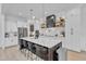 Modern kitchen featuring a large island with seating, sleek countertops, and stainless steel appliances at 472 Stonecrest Way, Pittsboro, NC 27312