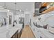 Contemporary kitchen featuring long island, stainless appliances, and open floor plan at 472 Stonecrest Way, Pittsboro, NC 27312