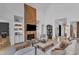 Inviting living room showcasing fireplace, built-in shelving, and comfortable furniture at 472 Stonecrest Way, Pittsboro, NC 27312
