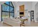 Bright living room with high ceilings, a large window, and modern fireplace at 472 Stonecrest Way, Pittsboro, NC 27312