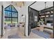 Open-concept living room, visible from the entryway, featuring a large window and modern furniture at 472 Stonecrest Way, Pittsboro, NC 27312