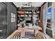 Stylish home office featuring custom built-ins, modern light fixture, and black and white striped rug at 472 Stonecrest Way, Pittsboro, NC 27312