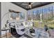 Relaxing screened porch featuring stylish decor, comfortable seating, and ceiling fan at 472 Stonecrest Way, Pittsboro, NC 27312
