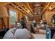 Unfinished basement with exposed wooden beams, a window, and miscellaneous stored items at 494 Terry Rd, Hillsborough, NC 27278