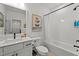 Modern bathroom features white subway tile, a black shower head, and white cabinets at 494 Terry Rd, Hillsborough, NC 27278